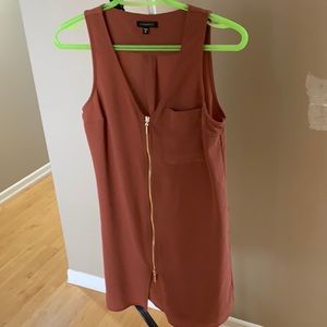 Woman’s size Xs reddish pink sleeveless blouse.